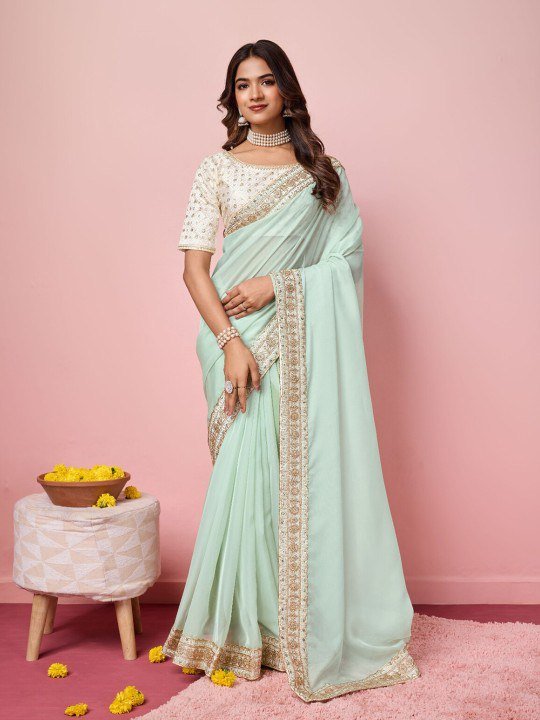 Woman wearing elegant organza saree with heavy embroidered mono banglori blouse – wedding festive saree