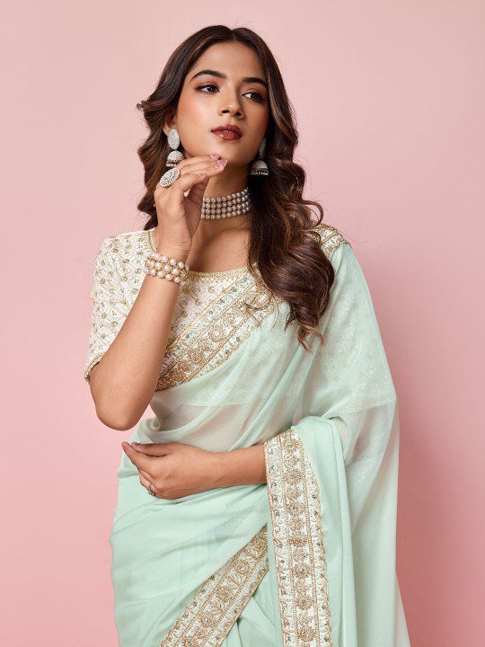 Close-up of organza saree fabric with sequin and zari embroidery – designer festive saree detail