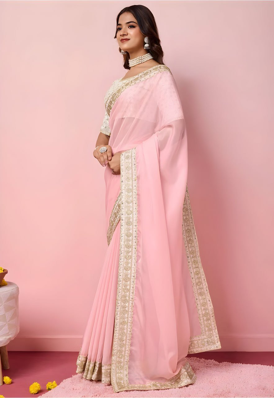 Close-up of pink organza saree fabric with sequins and zari embroidery – designer festive saree