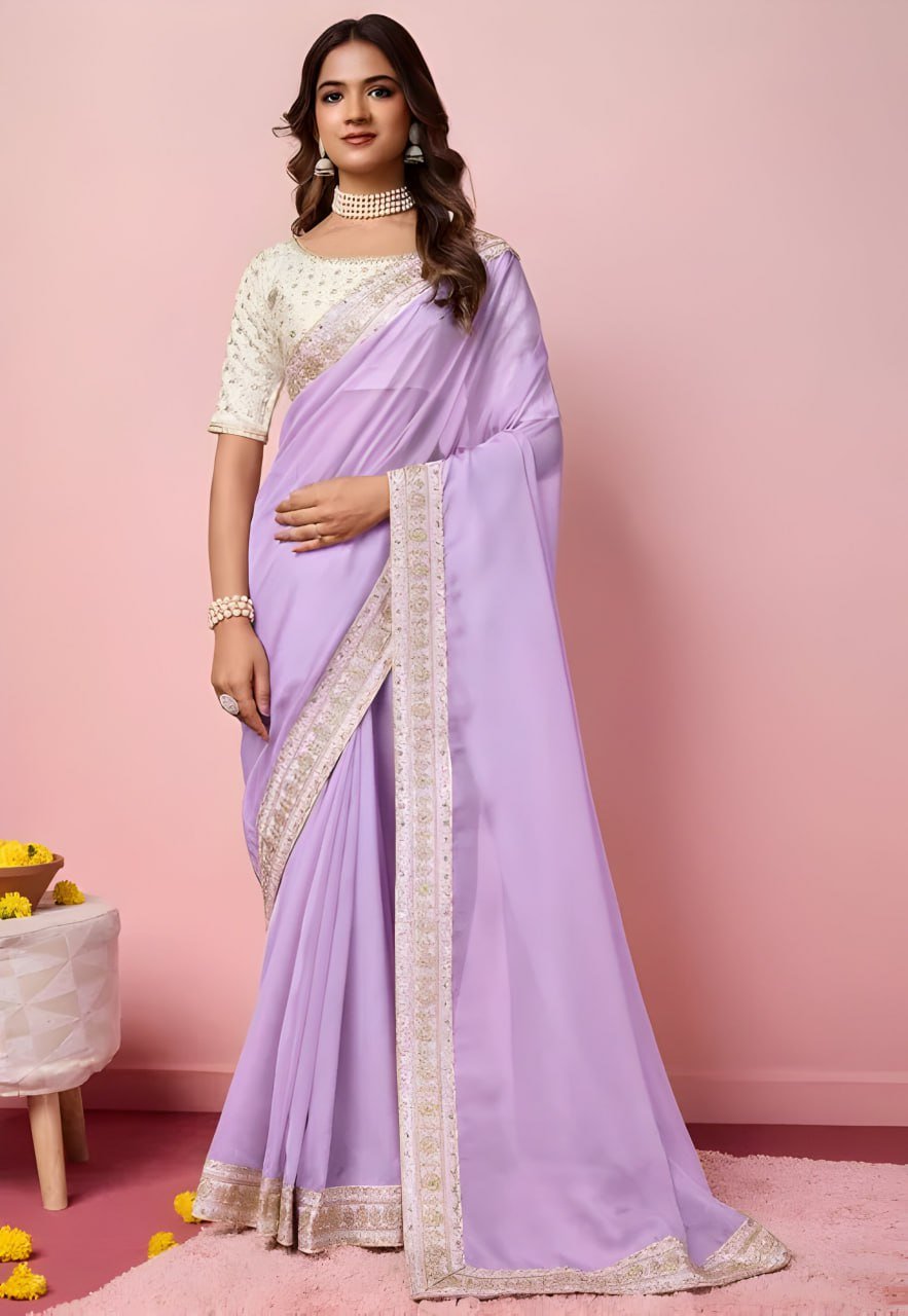 Woman wearing purple organza saree with heavy embroidered mono banglori blouse – party wear saree