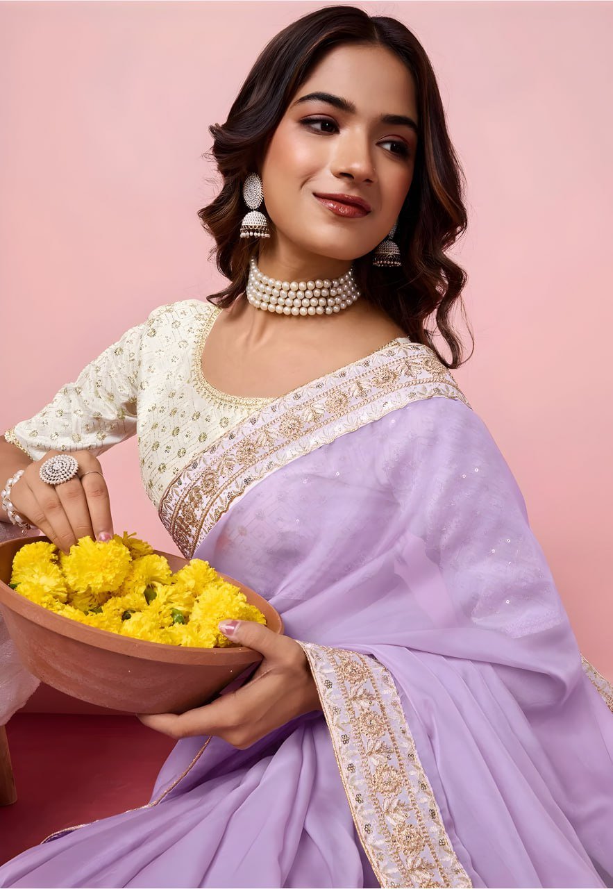 Close-up of purple organza saree fabric with zari and sequin embroidery – designer saree detail