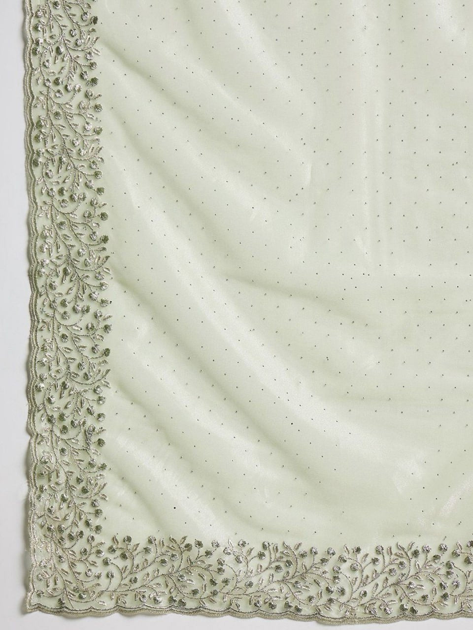 Pallu of leaf green hotfix cutwork net saree with stones and beads embroidery – luxury festive saree