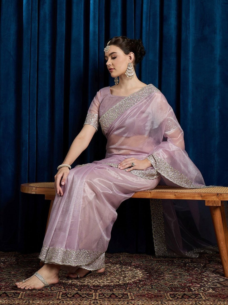 Woman wearing pink embellished hotfix cutwork net saree with beads and stones – party wear saree