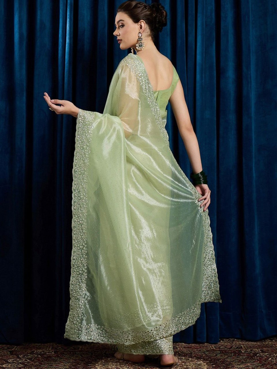 Pallu of leaf green hotfix cutwork net saree with stones and beads embroidery – luxury festive saree