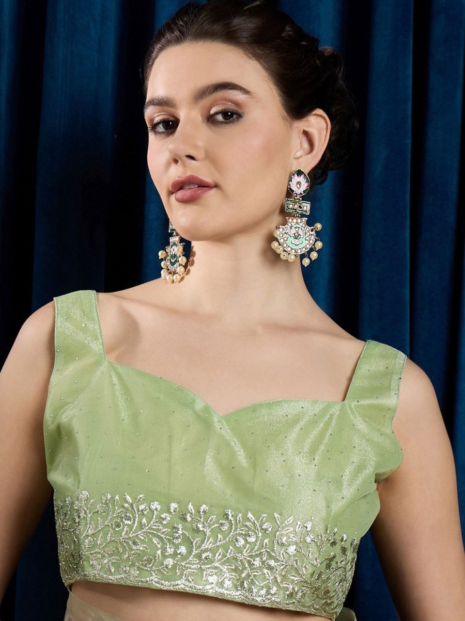 Matching embellished blouse piece of leaf green hotfix net saree – designer wedding saree