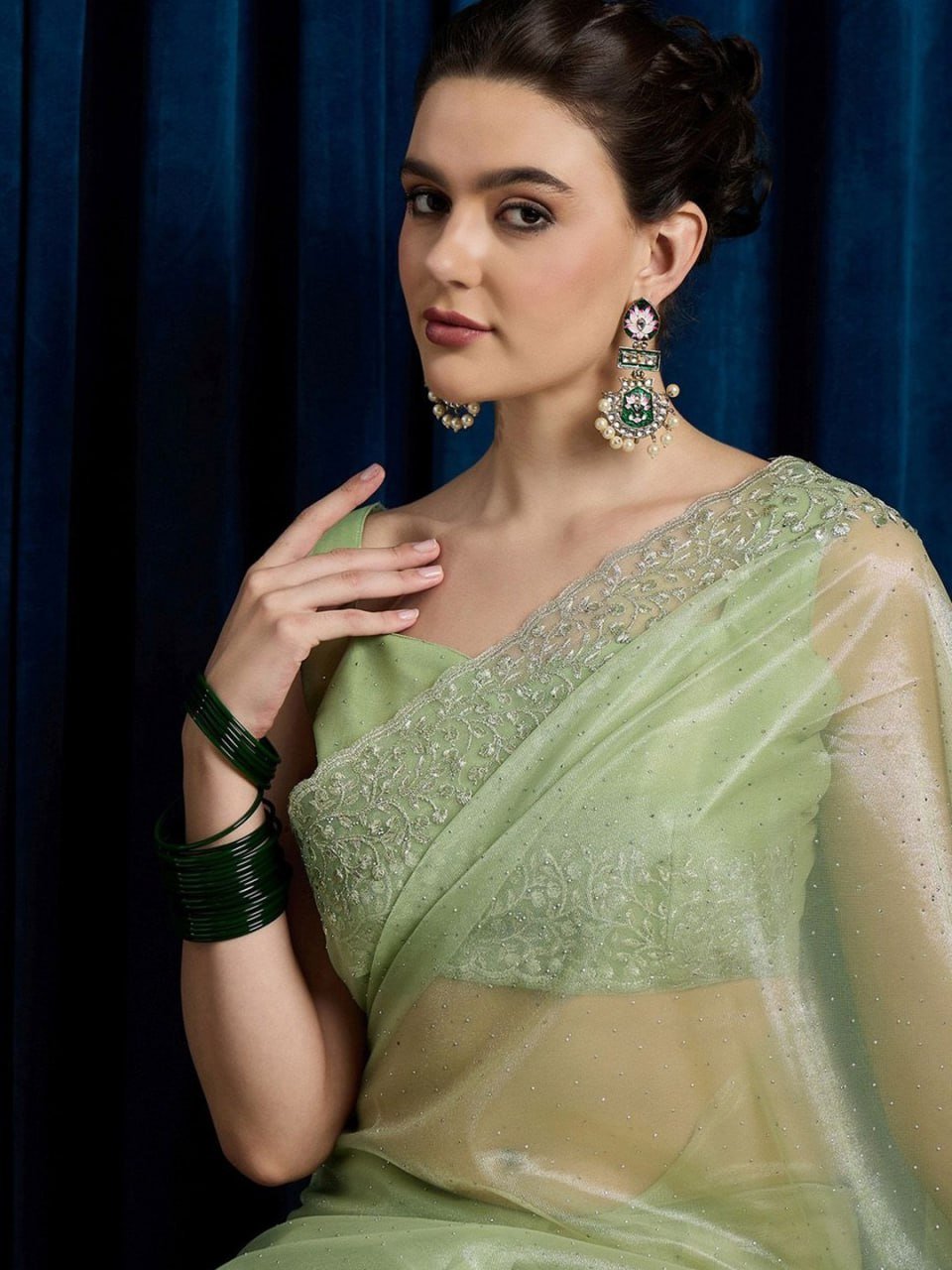 Pallu of leaf green hotfix cutwork net saree with stones and beads embroidery – luxury festive saree