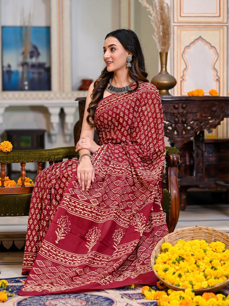 Woman wearing cotton red printed saree – ready to wear stitched saree for festive and office wear