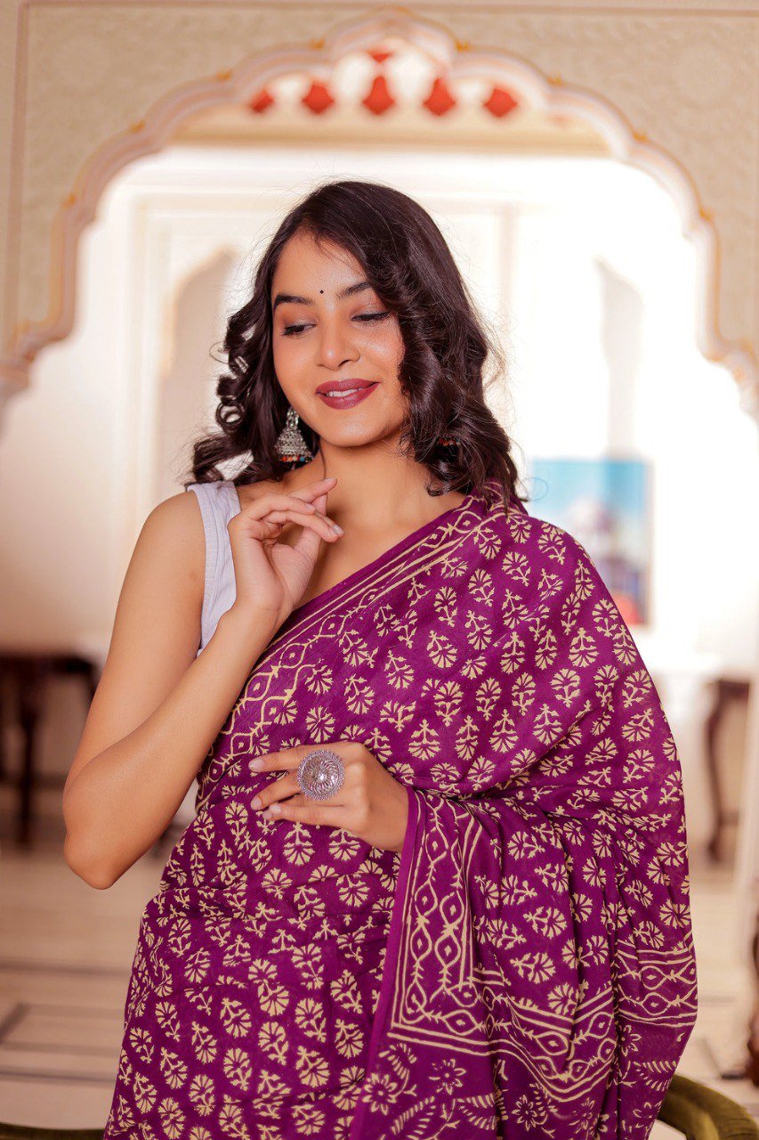 Close-up of dark purple cotton saree fabric with bold print motifs – breathable cotton weave