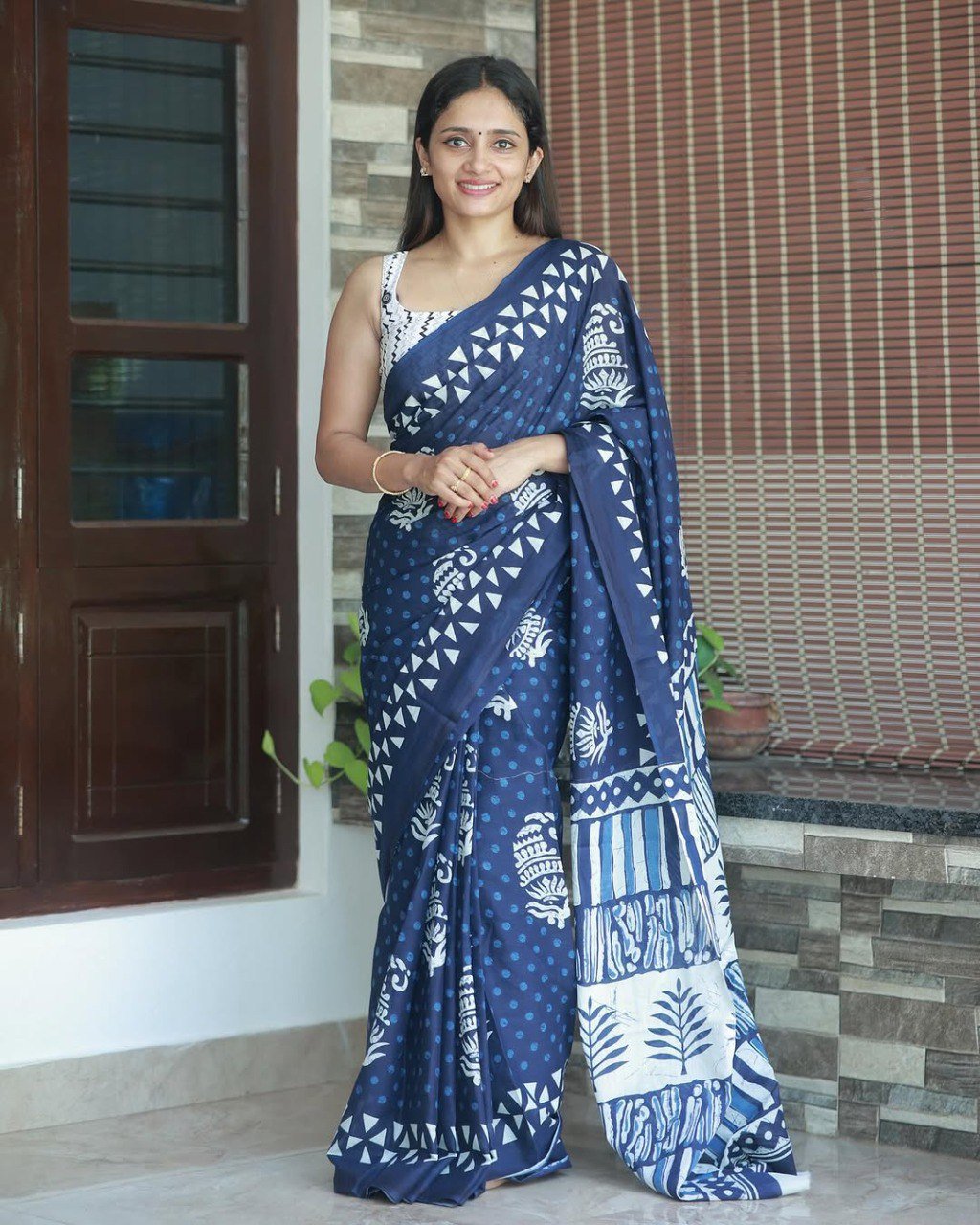 Close-up of soft cotton dark blue saree with elegant white floral print pattern