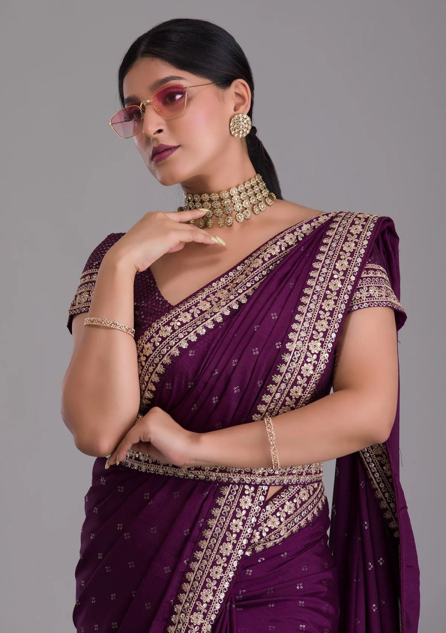 Woman wearing dark purple heavy work saree with sequins and belt – elegant wedding party wear saree