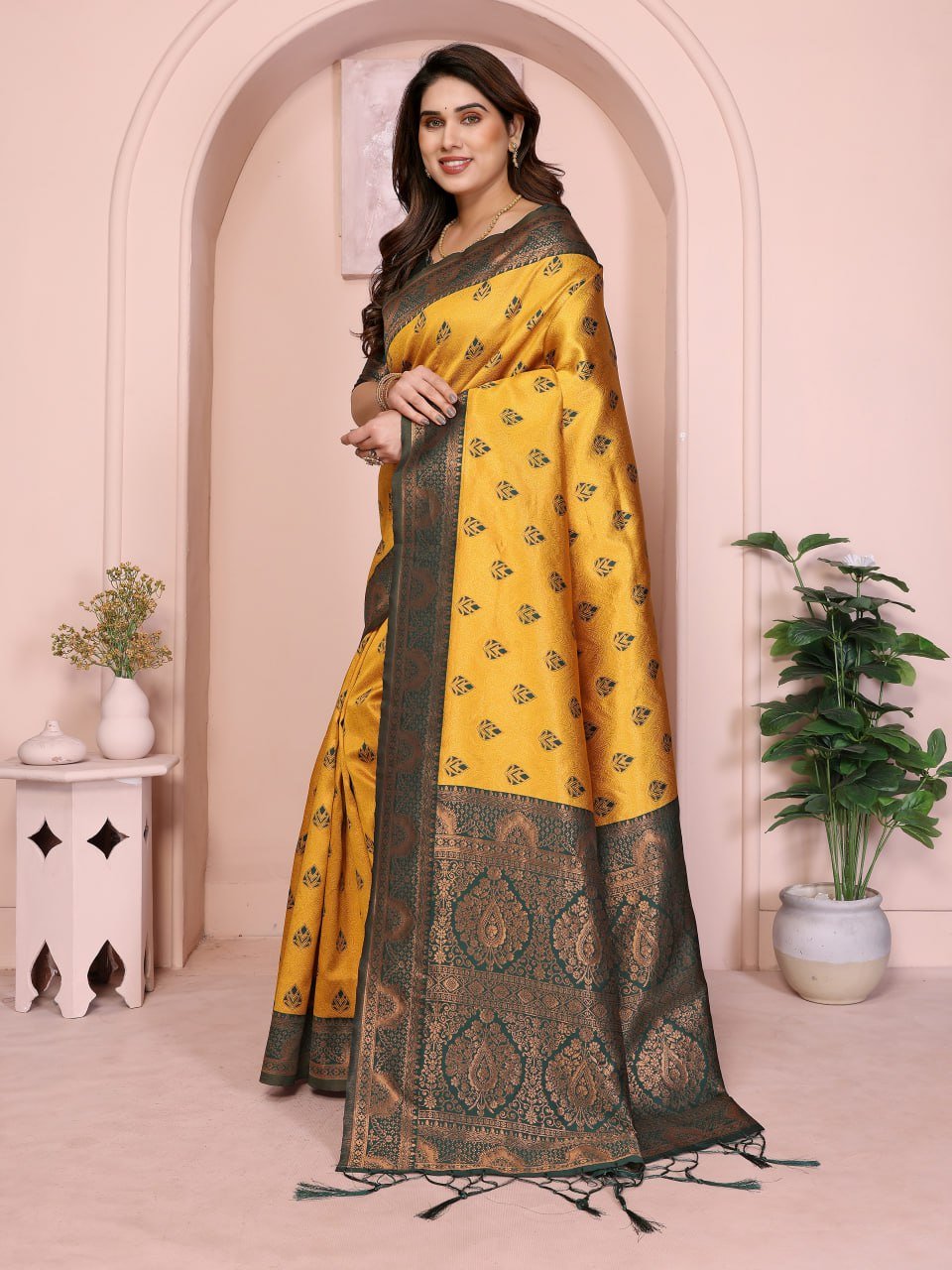 Close up of yellow Banarasi soft silk saree jacquard weave and gold zari border