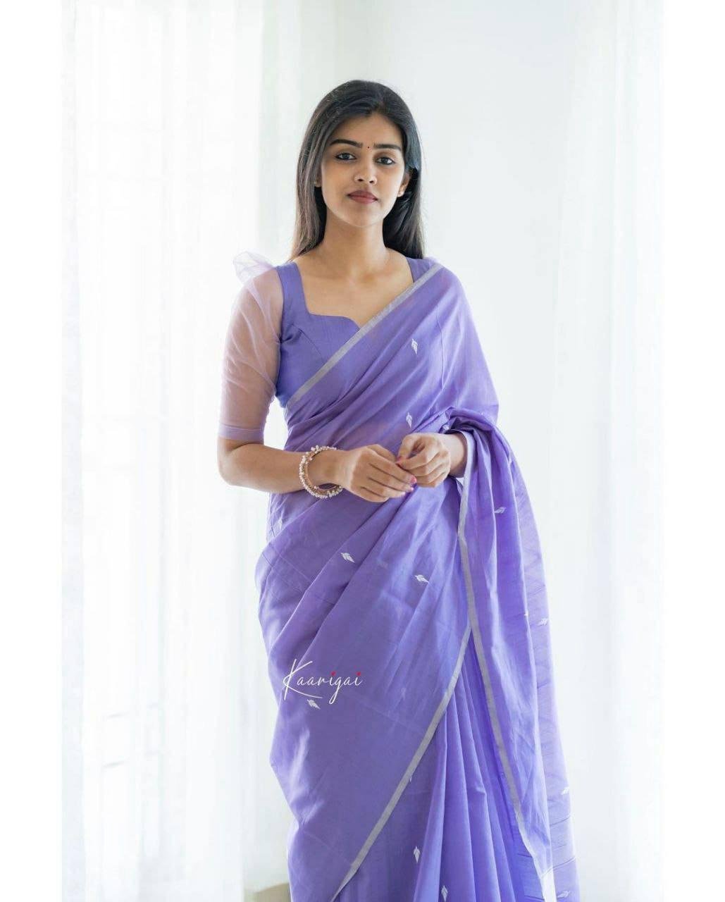 Woman wearing light purple jacquard work soft lichi silk saree – festive party wear saree