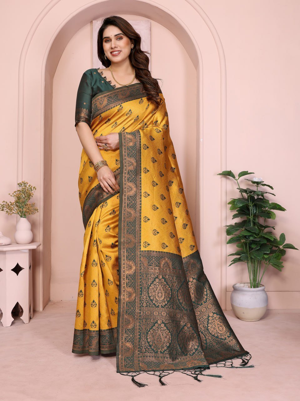 Woman wearing yellow Banarasi silk saree with jacquard border and zari motifs, traditional festive Indian wear